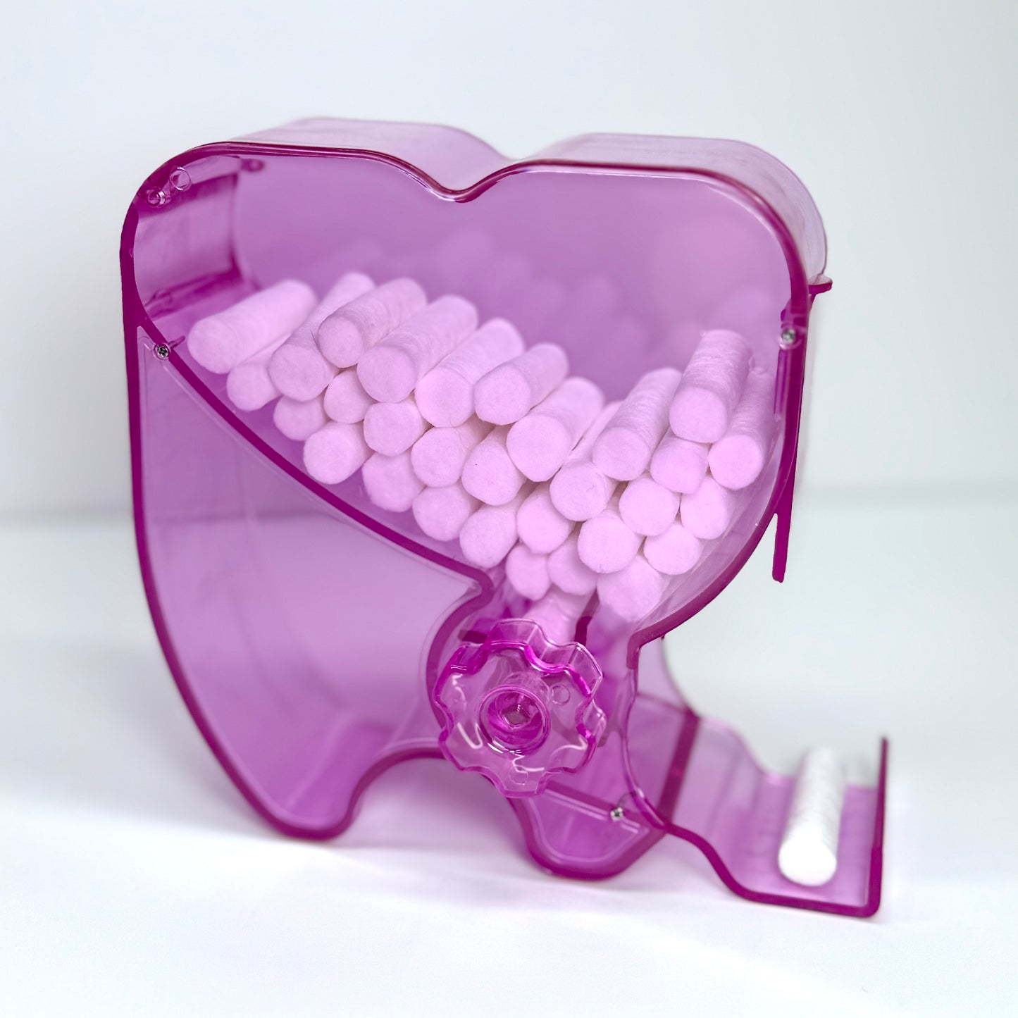 Dispensador de rollos de algodón en forma de diente