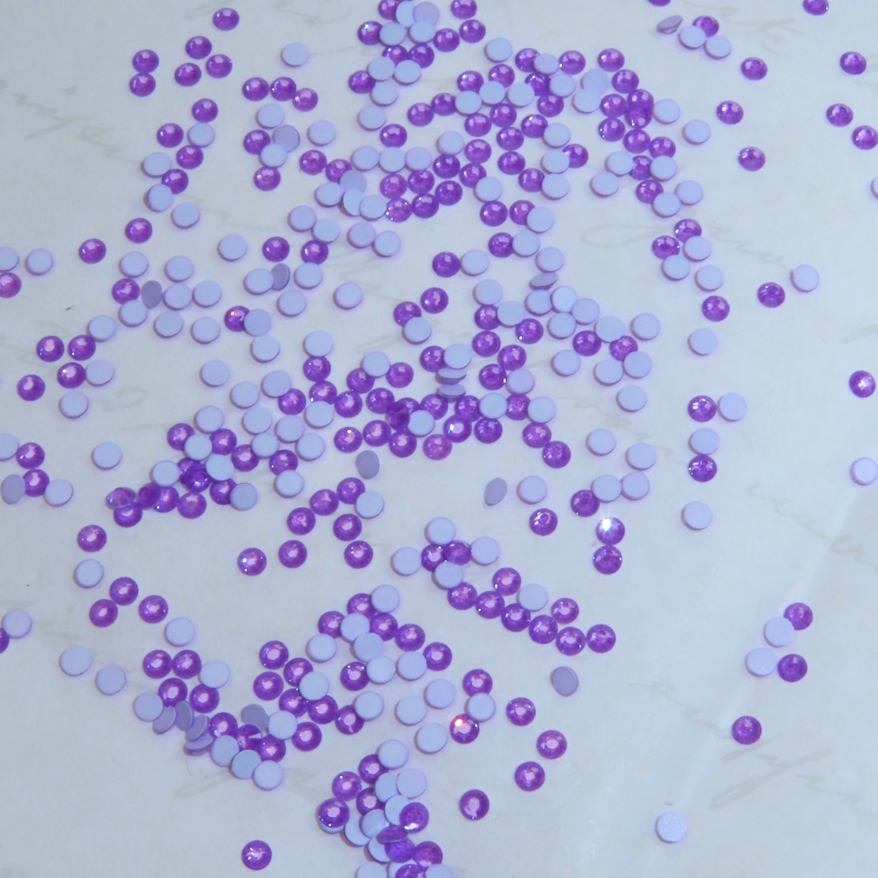 SWAROVSKI® 2058 round crystals - Electron Violet Ignite