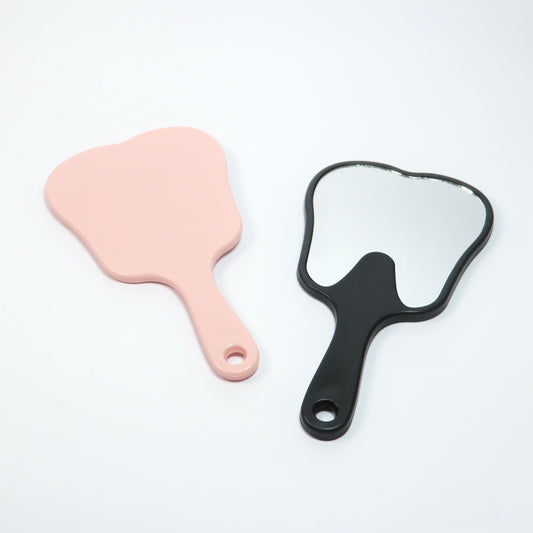 Espejo de mano en forma de diente