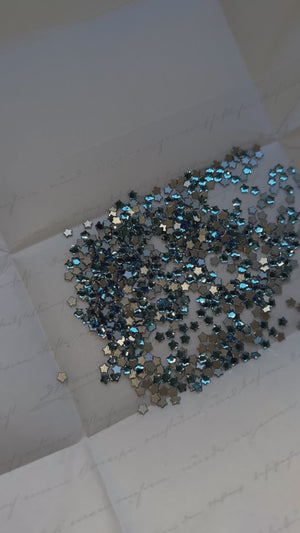 Pack 10 SWAROVSKI® Star Flower Tooth Gems - Aquamarine